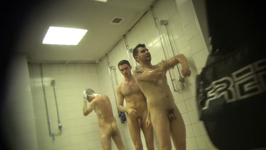 two guys in the shower room cruising