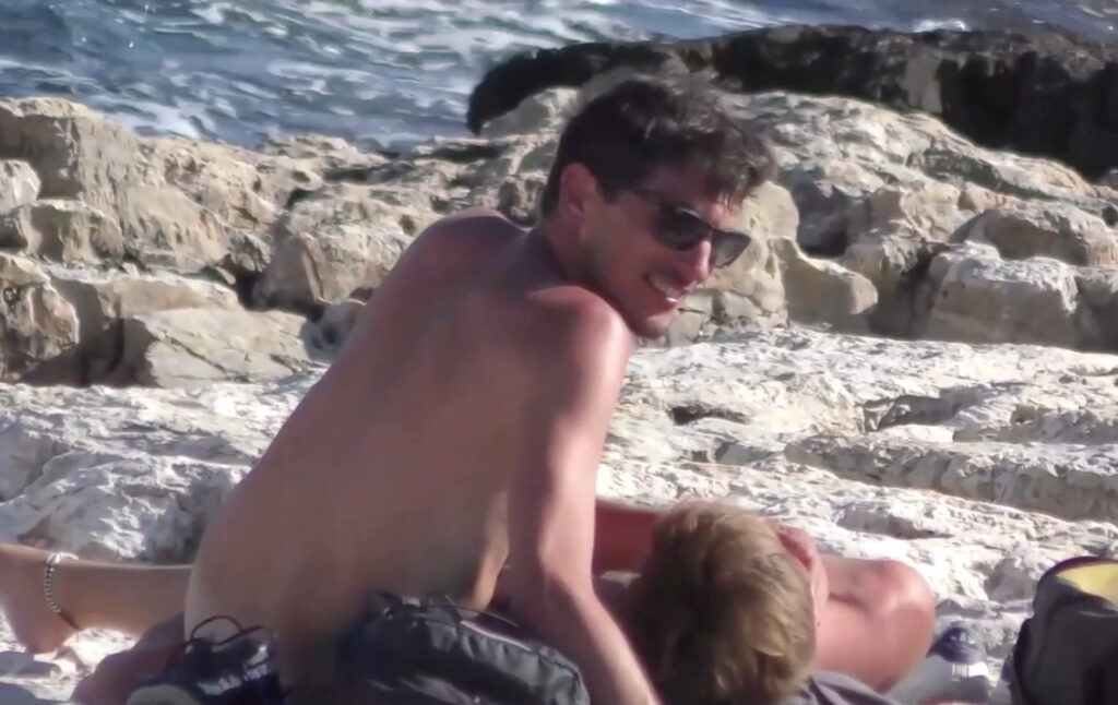 Handsome guys hook up at the beach